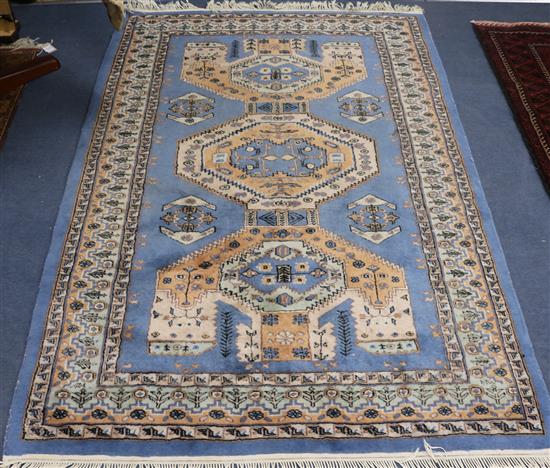 An Iranian blue ground rug 185 x 127cm